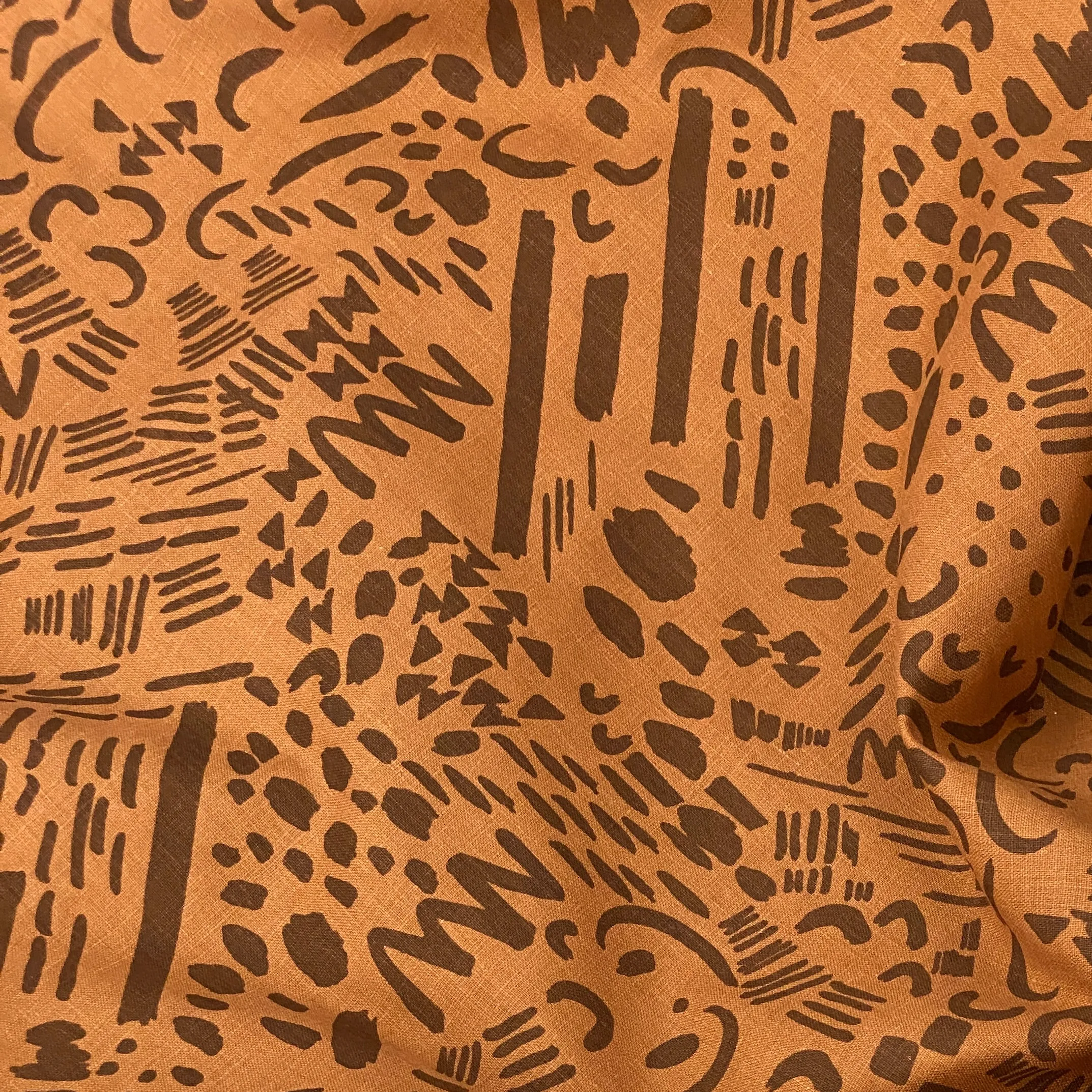 Dashes & Moons in Charcoal on Rust - 100% linen - FABRIC BY THE YARD